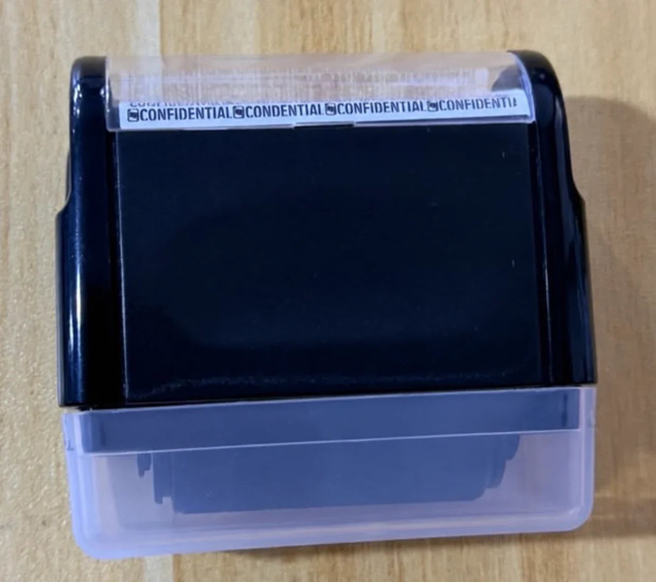 A dark blue privacy stamp photographed at home after use