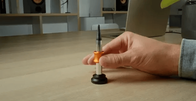 Animated Rocket Kinetic Desk Toy ring launching and landing on its base
