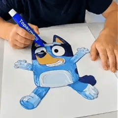 A blue cartoon character drawing being filled and finished with raised texture.