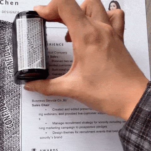 A privacy roller covering printed personal information on a sheet of paper