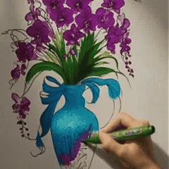 A floral vase drawing developing into a colorful raised relief artwork.
